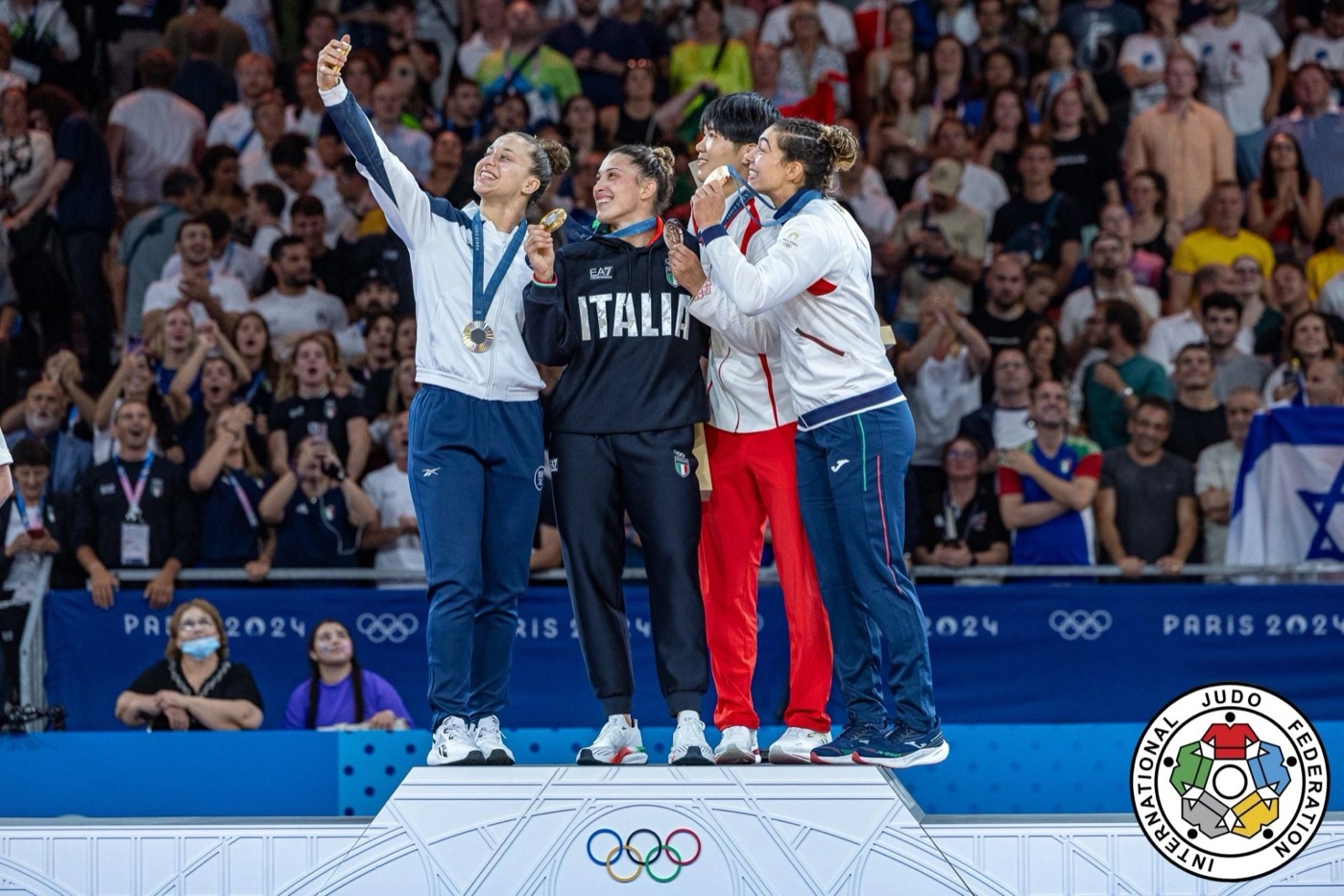 The –78 kg medallists take a selfie on the Paris 2024 Olympic podium; Inbar Lanir holds up her silver medal on the left.